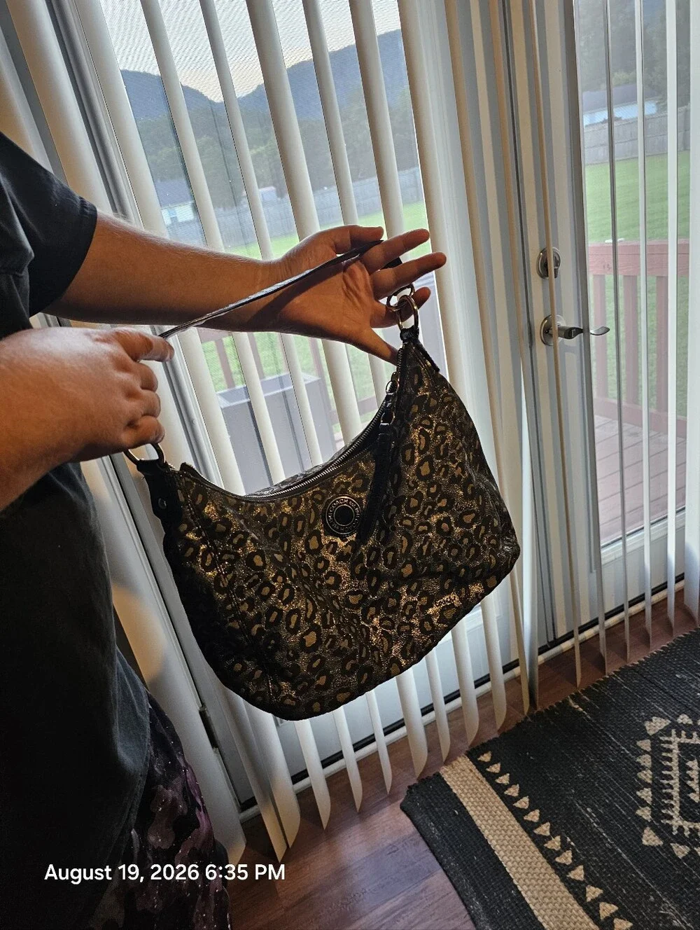 Discontinued Women's Black and Silver COACH Ocelet Hobo Bag F21063